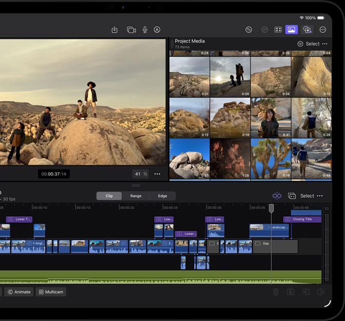 iPad Pro, front exterior, landscape orientation, space black, displaying Final Cut Pro interface with a desert adventure project open, photo of four people in desert landscape with multiple video clips and timeline