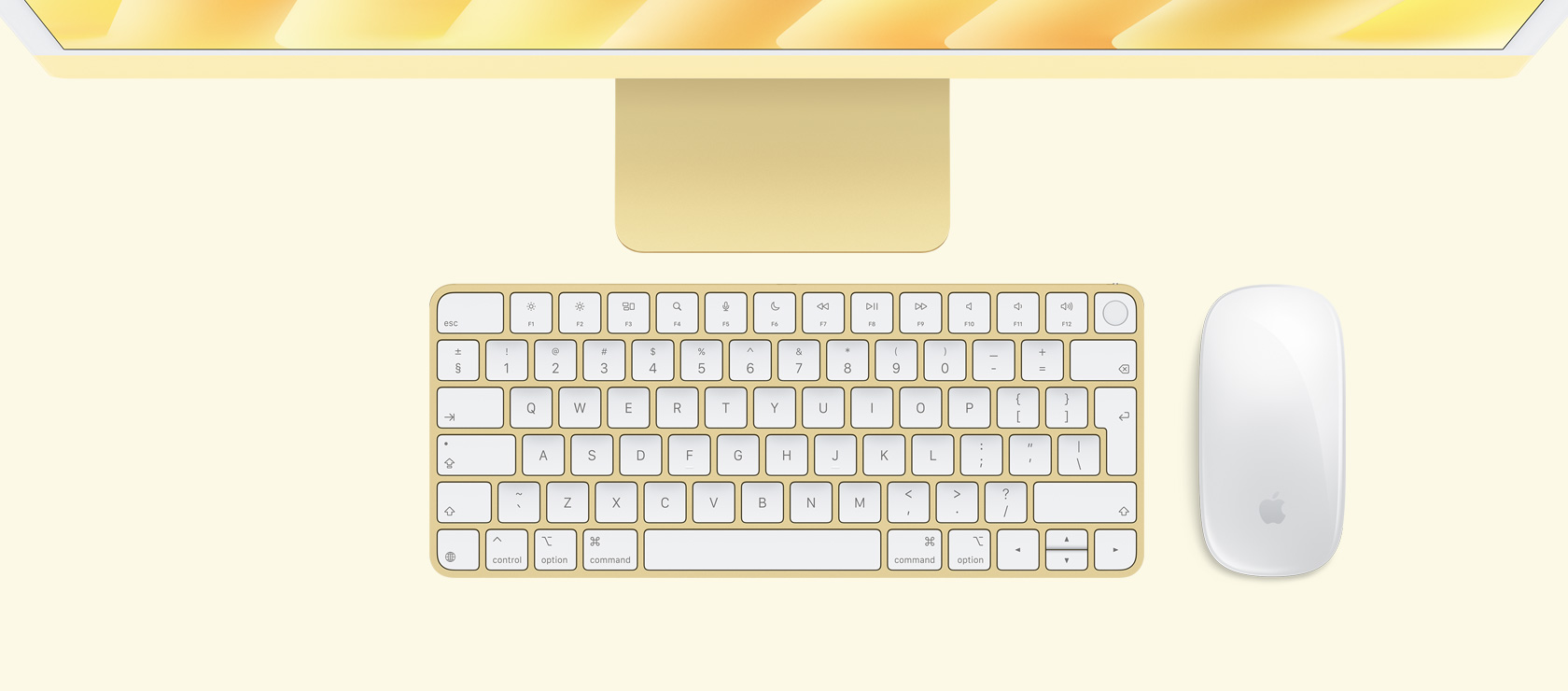 Overhead view of yellow iMac with color-matching mouse and keyboard