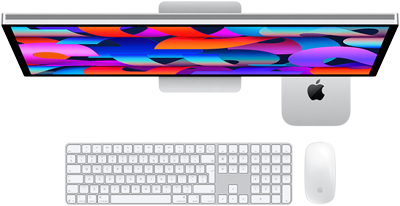Mac mini tucked under Studio Display, Magic Keyboard with Numeric Keypad, Magic Mouse