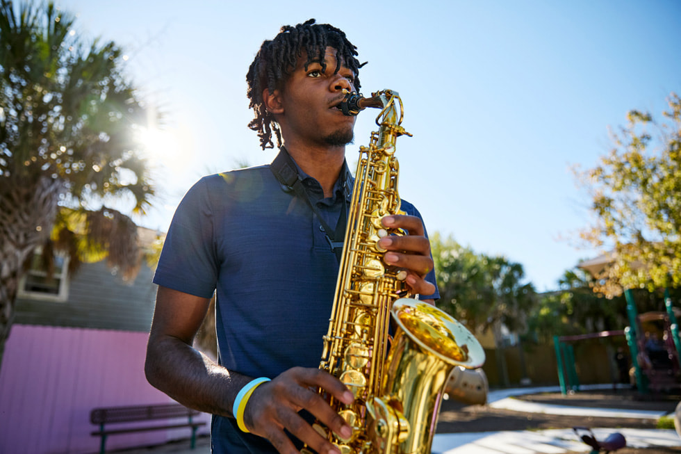 Ellis Marsalis Center for Music participant Jacob Jones Jr. plays the saxophone outside the centre.