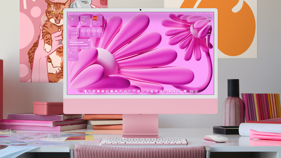 iMac shows the Home Screen with the new design.