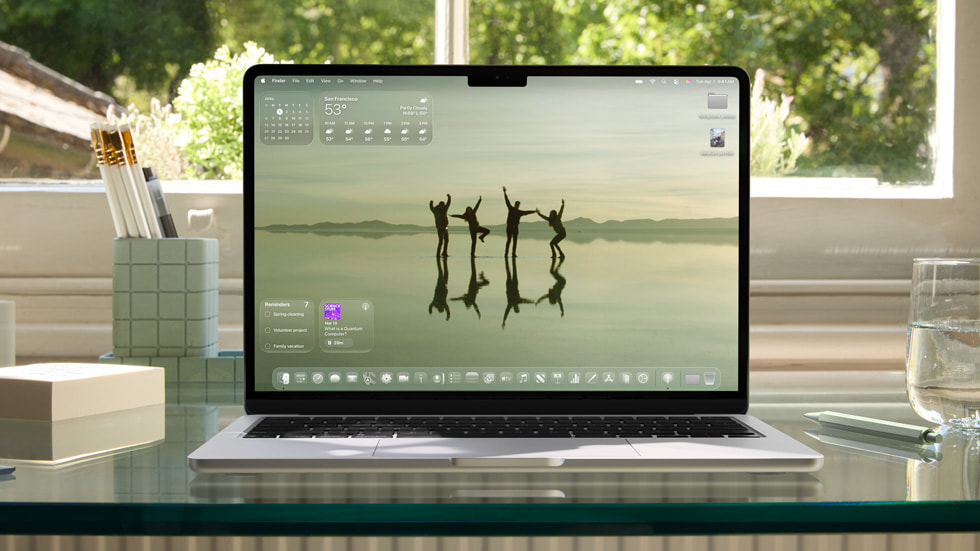 MacBook Pro shows the new design with a dark tint.