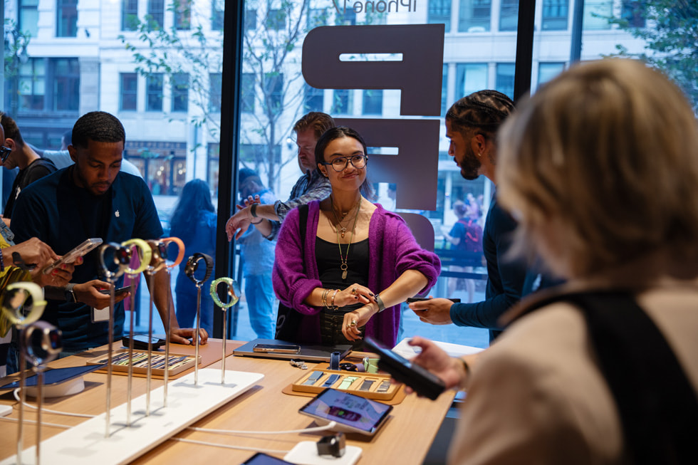 A customer tries on Apple Watch at Apple Downtown Detroit. 