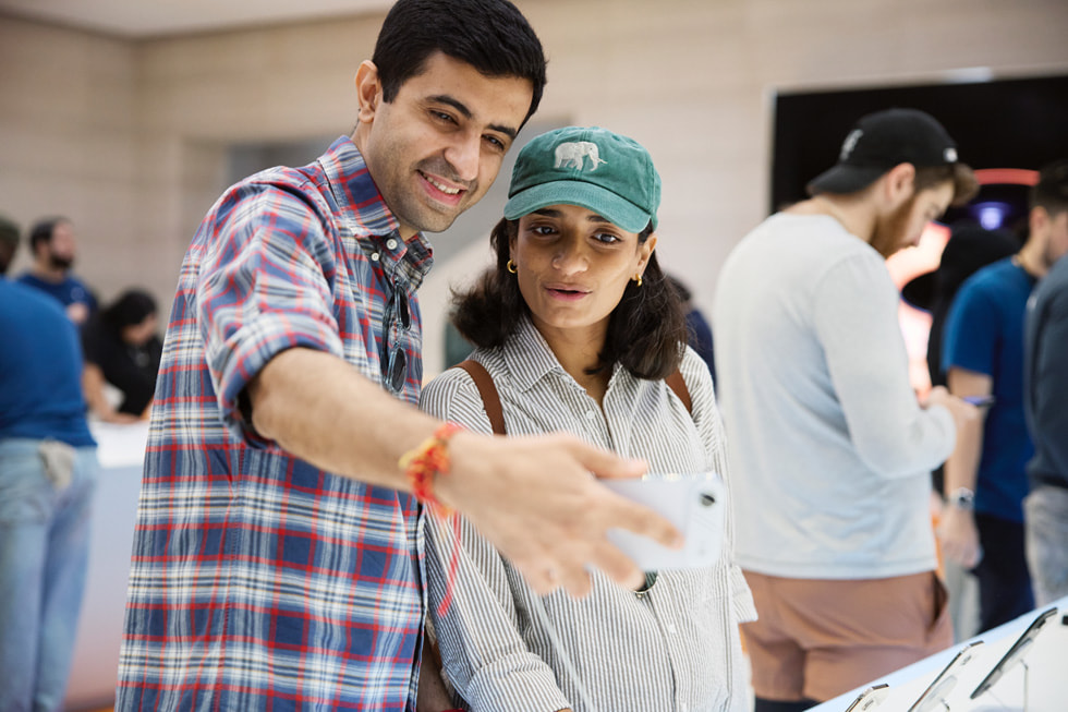 Two customers take a selfie with iPhone Air at Apple Fifth Avenue in New York.
