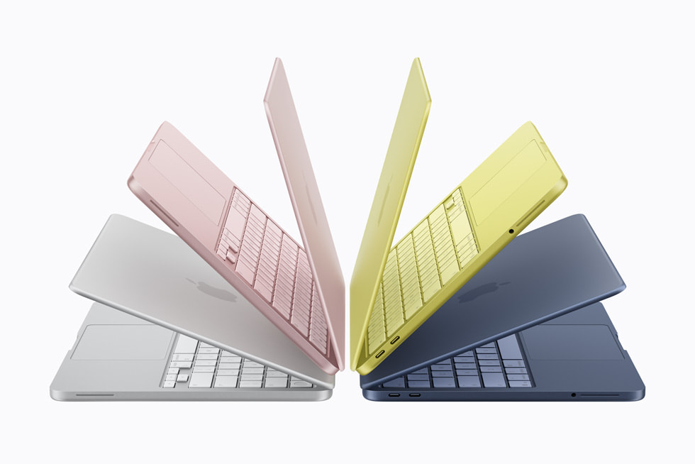A fanned-out array of MacBook Neo models in its four colors: silver, blush, citrus, and indigo.