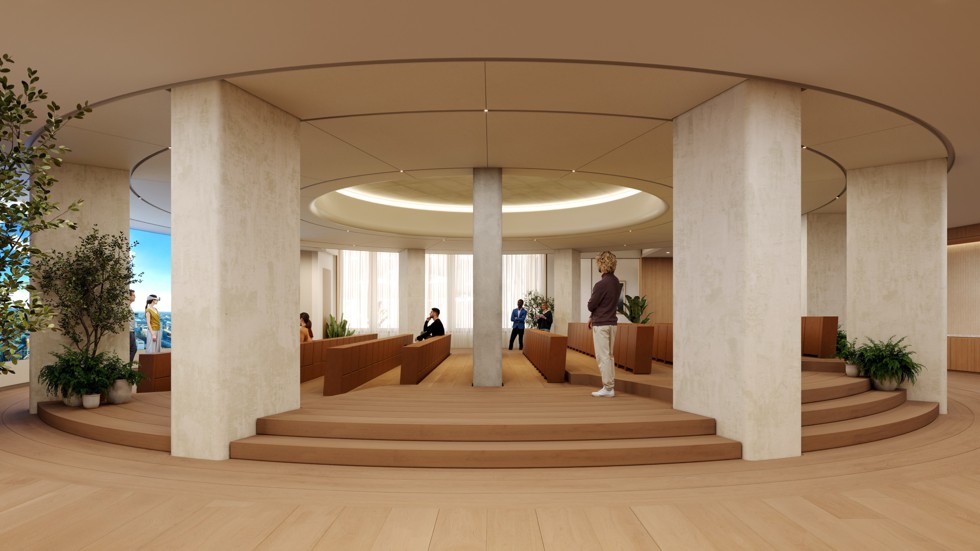 Ein großes, kreisförmiges Auditorium mit einem Präsentationsbereich auf der linken Seite
