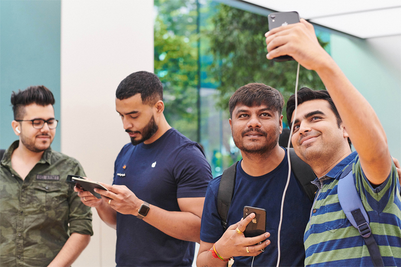 Customers and an Apple team member at Apple Orchard Road.