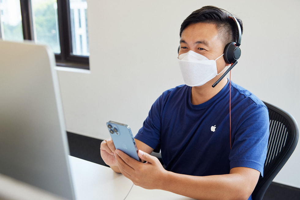 An Apple online team member at the call center in Shanghai advises a customer on the new iPhone 13 Pro Max. 