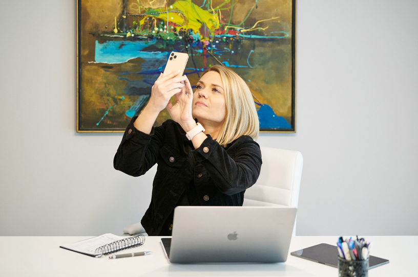 Sarah Hill in her office using the Healium AR app on iPhone 11 Pro.