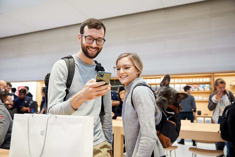 Customers use the new iPhone 11 Pro Max.