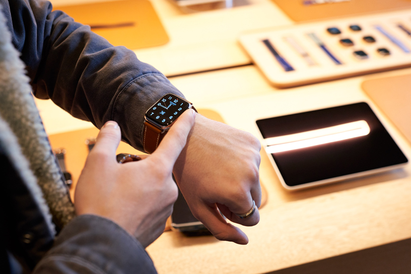 Customer tries on Apple Watch Series 5 at Apple Champs-Élysées.