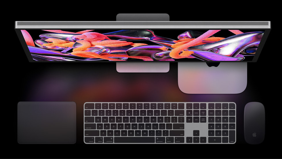 Mac mini is shown with Studio Display and Magic accessories.