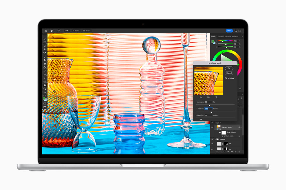 Editing an image in Adobe Photoshop on the MacBook Air in silver.