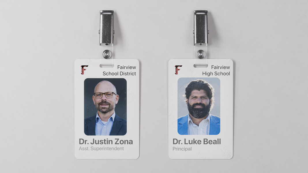 Two Fairview School District teacher name tags placed side by side, with Dr. Justin Zona’s on the left and Dr. Luke Beall’s on the right.