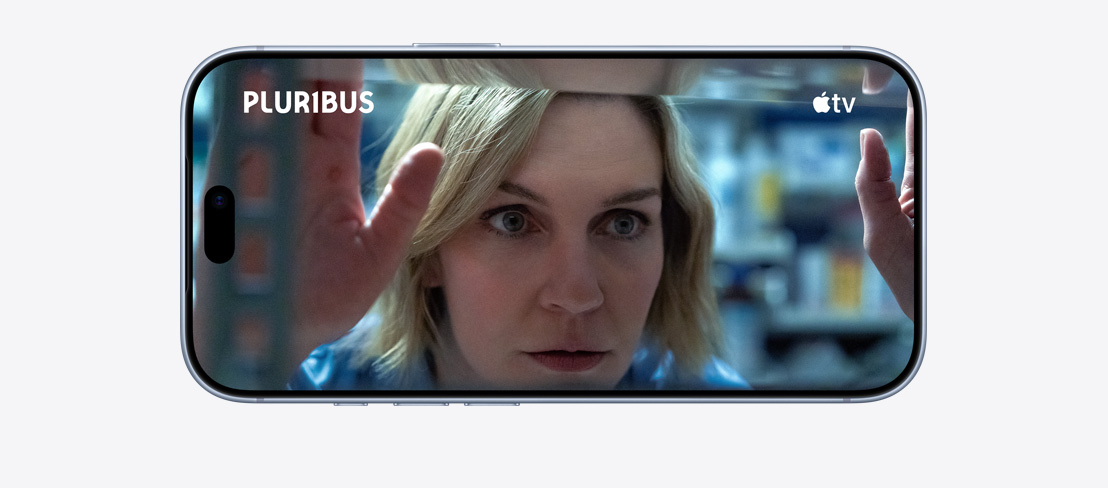 iPhone 18 Pro, Burgundy color, front exterior in a horizontal position, Apple TV show "Silo" plays on screen, volume up/down buttons, action button