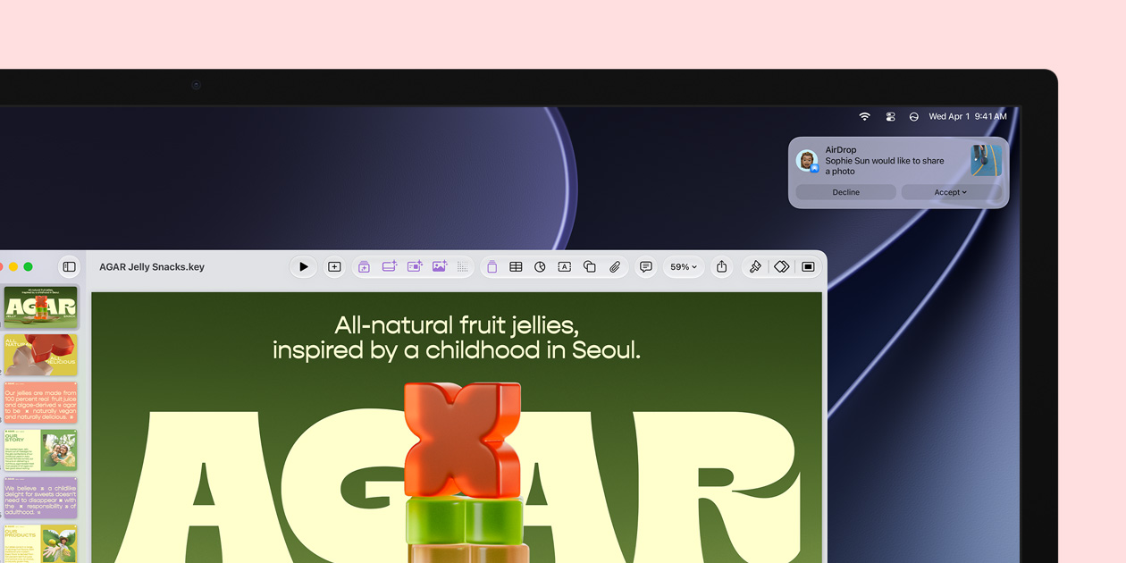 Studio Display screen showcases a Keynote about jelly snacks; a notification in the upper-right corner of the screen shows a request from another person to share a photo
