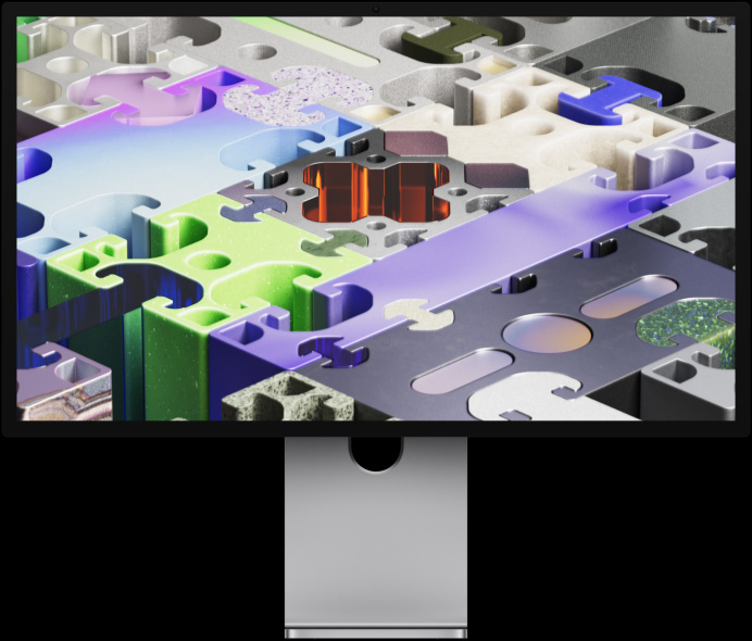 Üç boyutlu puzzle benzeri bir görsel içeren duvar kağıdına sahip Studio Display XDR’ın önden görünümü