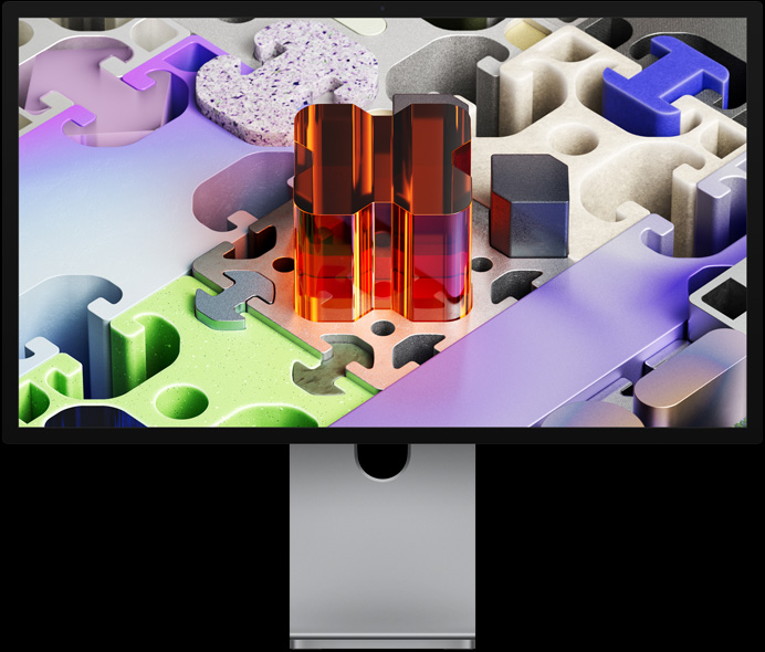 Üç boyutlu puzzle benzeri bir görsel içeren duvar kağıdına sahip Studio Display XDR’ın önden görünümü